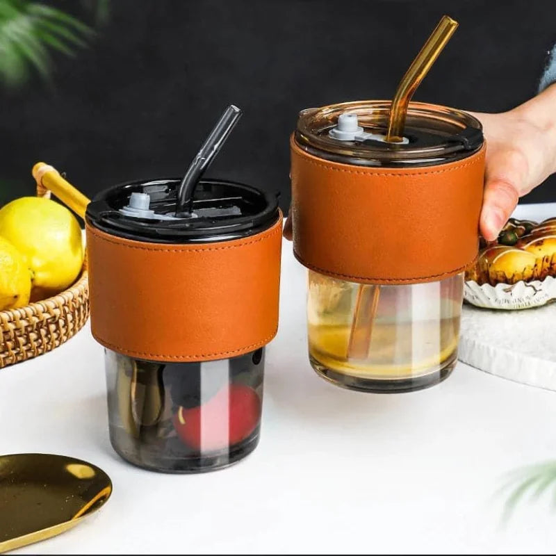 Stylish glass cup with lid and straw