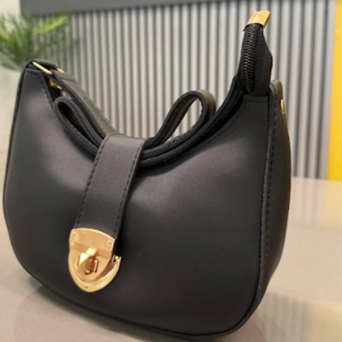 Elegant black crescent shoulder bag
