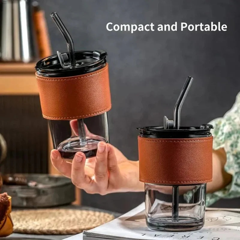 Stylish glass cup with lid and straw