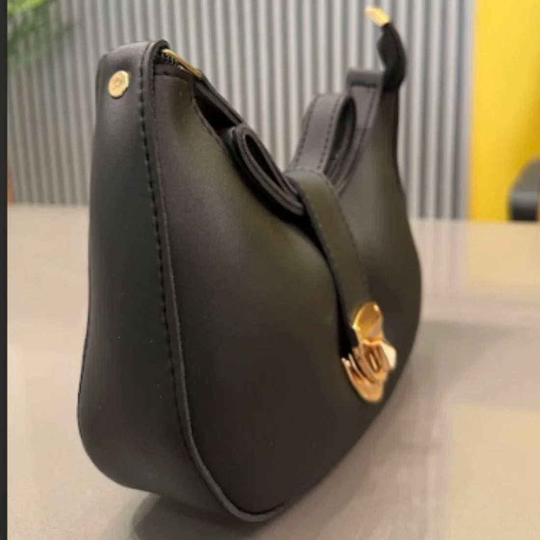 Elegant black crescent shoulder bag