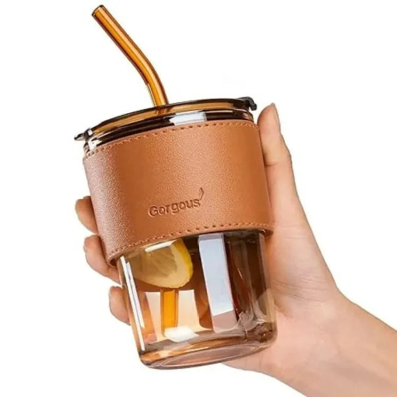 Stylish glass cup with lid and straw