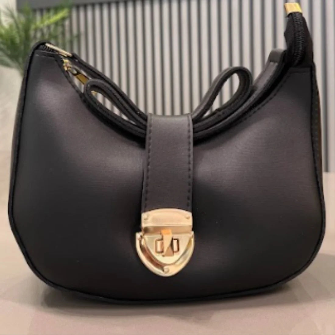 Elegant black crescent shoulder bag